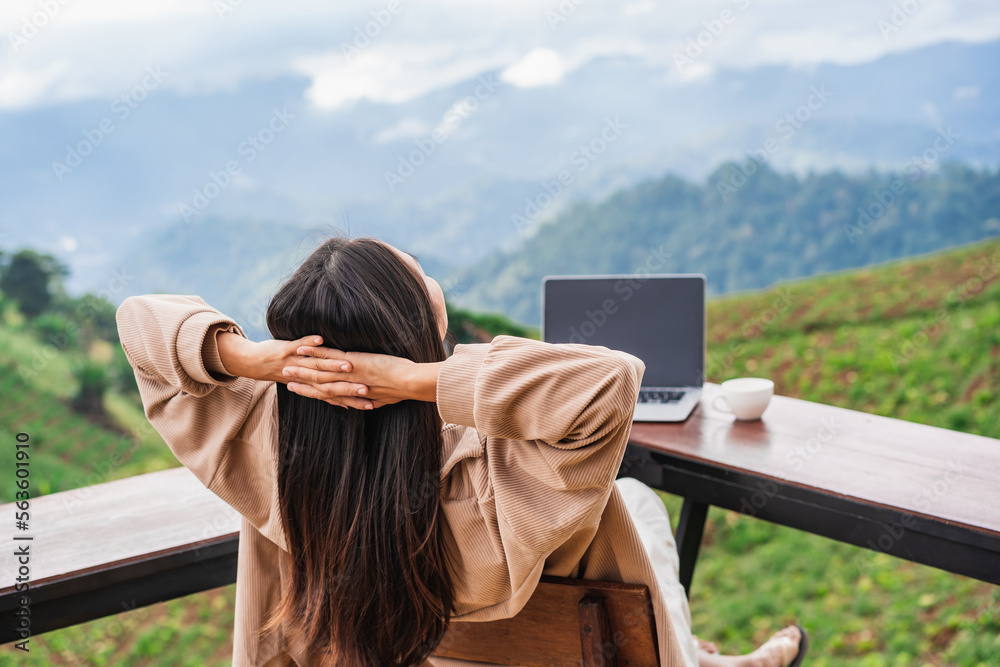 Young woman freelancer traveler working online using laptop and ...