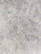 Dirty gray concrete floor with random crack pattern abstract vertical background texture
