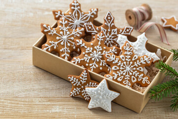 Wall Mural - Christmas homemade gingerbread snowflakes icing cookies in box