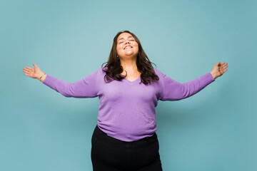 Wall Mural - Carefree young woman feeling relaxed and happy