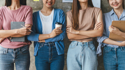 Wall Mural - Group of young Asian business women meeting together in the office.