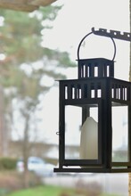 Candle In A Glass Candlestick Hanging Outdoors