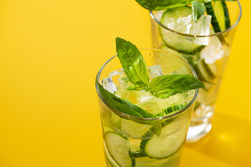 Wall Mural - Fresh cucumber water with green leaves basil