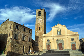 Historic church with bell tower and stone buildings in the historical village of Bagnoregio