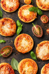 Wall Mural - Mini pizzas with tomatoes and mozzarella cheese