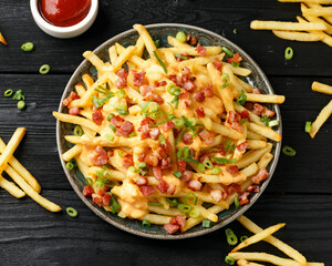 Crispy French fries loaded with bacon, cheese sauce and spring onion