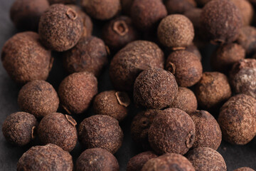 Poster - big pile of natural allspice in peas