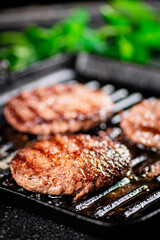 Grilled burger in a frying pan. 