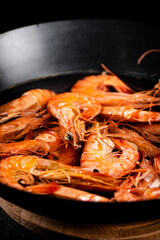 Poster - Saucepan with cooked boiled shrimp. 