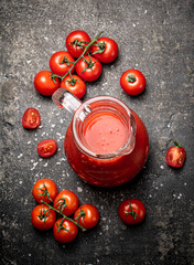 Poster - Jug with tomato juice on the table. 