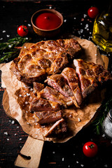 Canvas Print - Delicious grilled pork steak with tomato sauce and rosemary. 