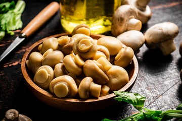 Canvas Print - Fragrant pickled mushrooms in a plate with greens. 