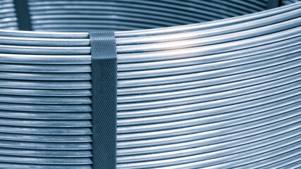 Poster - Stainless steel wire rolls in the construction site. Closeup of metal steel reinforced rod for concrete in store. Construction metal industry concept background
