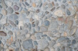 © Cloudy Design - Natural rock wall background. Stone or brick wall texture.