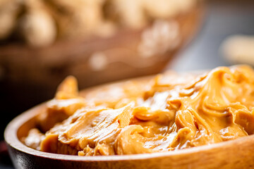 Canvas Print - Peanut butter on a plate. Macro background.