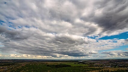 Wall Mural - Beautiful Endless Clouds in the Daylight Skies Seamless. Looped 3d Animation Flying Above the Cumulus Clouds with 4k 4096 2304