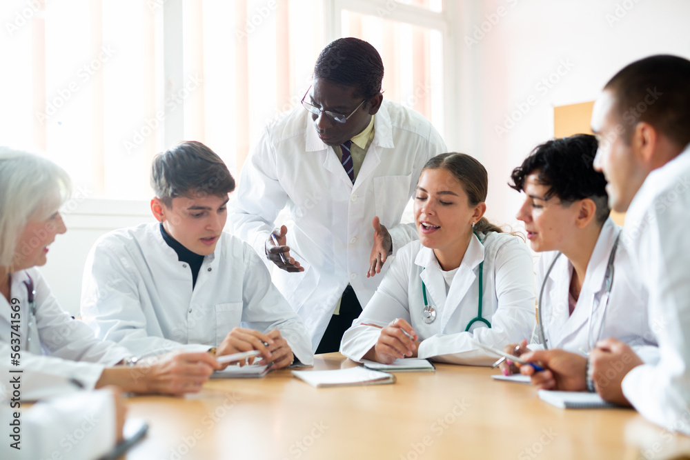 African-american man professor explaining subject to group of medical ...