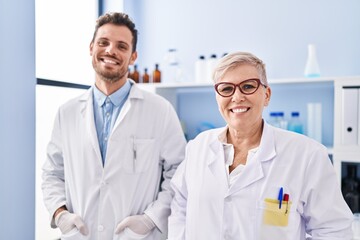 Sticker - Mother and son scientist partners standing at laboratory