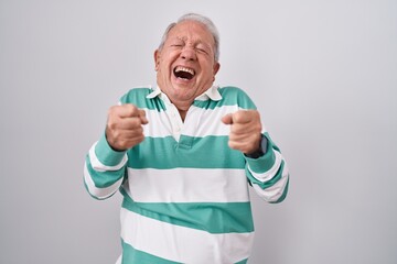 Sticker - Senior man with grey hair standing over white background excited for success with arms raised and eyes closed celebrating victory smiling. winner concept.