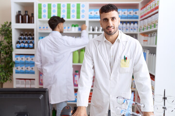 Sticker - Two hispanic men pharmacists smiling confident working at pharmacy