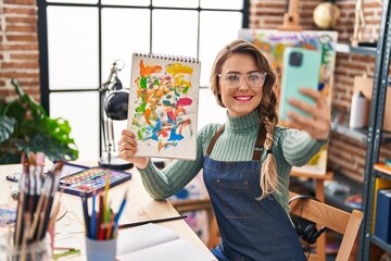 Sticker - Young woman artist smiling confident making selfie by smartphone at art studio