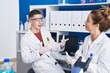 © Krakenimages.com - Man and woman scientists speaking at laboratory