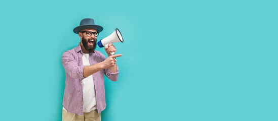 Wall Mural - Funny portrait of an emotional hipster guy with a megaphone. Collage in magazine style. Flyer with trendy colors, advertising copy space. Discount, sale season. Information concept. Attention news!