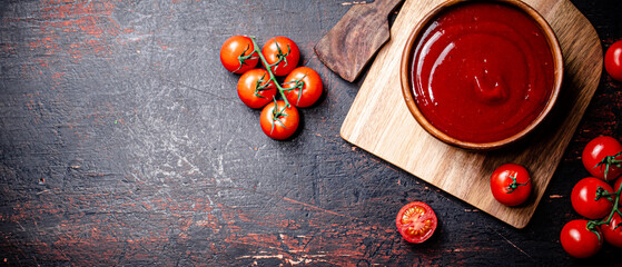 Wall Mural - Tomato sauce on a wooden cutting board. 