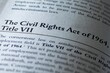 © Jon - legal or law book with Civil rights act of 1964 Title VII focused in closeup of explanation