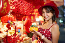 Thai Woman Posing With Chinese New Year Good Luck Pumpkin At Market