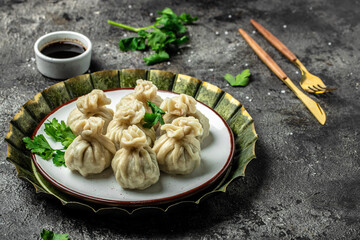 Khinkali with meat on plate. Restaurant menu, dieting, cookbook recipe top view