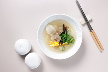 Wall Mural - Tteokguk is Korean rice cake soup eaten on Korean New Year or Seollal.