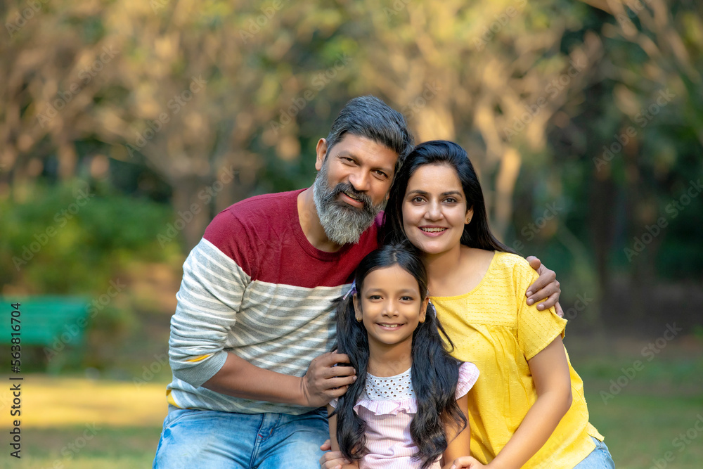 Happy indian couple with his little daughter at park. Stock Photo ...