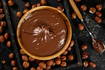 Poster - Hazelnut butter on a cutting board with a spoon. 