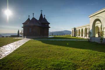 Wall Mural - Old wooden church from Orthodox Monastery of Nuns from Salva, Built in 1994, Bistrița.Romania Image of October 20222