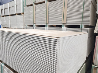 Wall Mural - plasterboard sheets stacked in a hardware store. dry gypsum plaster. building material for the arrangement of cladding, partitions, ceilings in buildings.