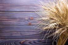 Wheat Stems, On Wooden Background Harvest Concept