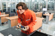 © chachamp - Caucasian technician engineer man use remote control with checking machine at factory