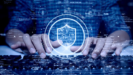 Fototapete - digital technology concept cyber security data protection internet network connection. Man accessing a computer device with a protective shield against cyber threats. polygon on dark blue background.