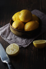 Poster - A bowl with yellow bright lemons