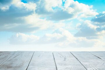 Wall Mural - wooden table, blue sky