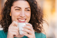 Happy Woman Having Coffee At Sunset