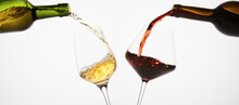 Pair Of Wineglasses Are Filled With White, Red Wine.