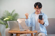 © mojo_cp - Happy Asian man using smartphone and Excited.