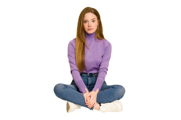 Poster - Young redhead woman sitting on the floor cut out isolated showing a dislike gesture, thumbs down. Disagreement concept.