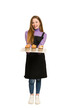 © Asier - Full body of a young redhead woman  holding a recently made muffins cut out isolated