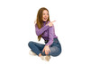 © Asier - Young redhead woman sitting isolated cut out