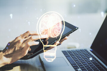 Poster - Double exposure of creative light bulb hologram with human brain and with finger clicks on a digital tablet on background, idea and brainstorming concept