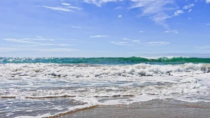 Wall Mural - Sea waves surf on the beach during summer day with splashes