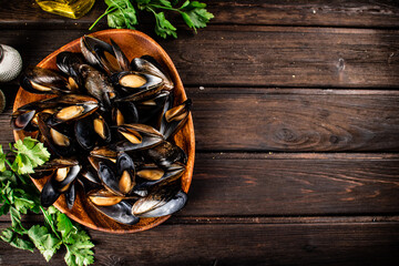 Sticker - Boiled mussels in a plate with parsley. 